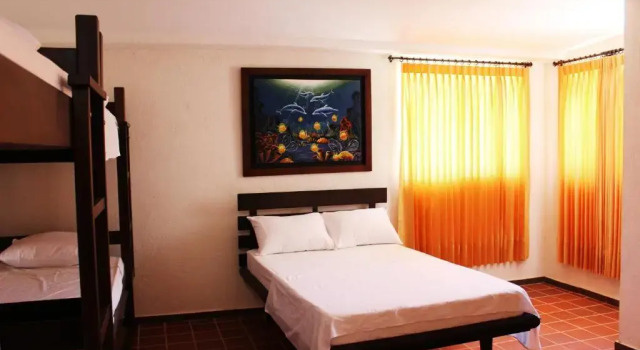 Кровать в общем номере Hotel San Marcos Taganga