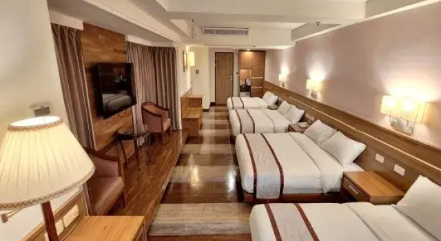 Кровать в общем номере Cheng Pao Hotel
