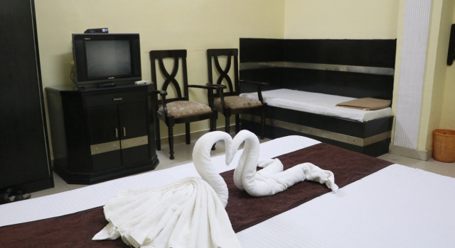 Трёхместный номер Executive Hotel Vaishnavi