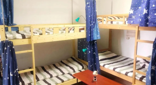 Кровать в общем номере ZaijianJianghu Youth Hostel