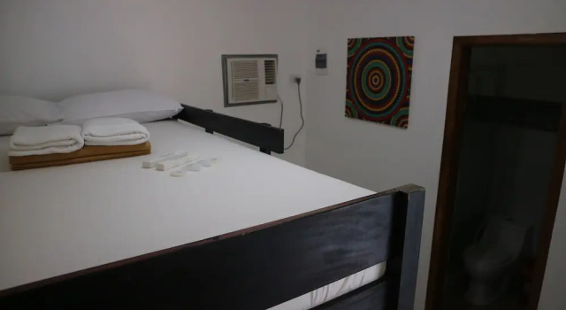 Кровать в общем номере La Patricia Hotel