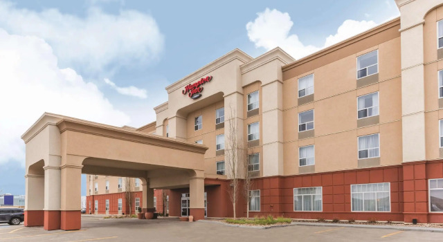 Кровать в общем номере Hampton Inn by Hilton Edmonton South