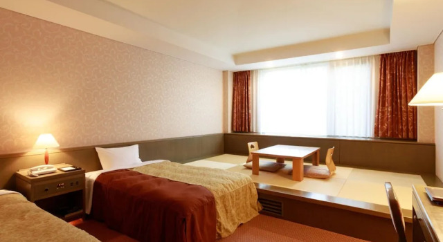 Кровать в общем номере Kiyosato Kogen Resort