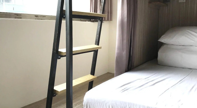 Vuode makuusalissa Corner Hostel & Cafe