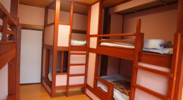 Кровать в общем номере Hotel Nikko-Kinugawa Inn Miyasaki