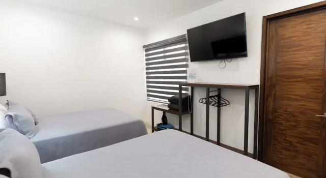 Camera quadrupla Comfort Hotel Manadia