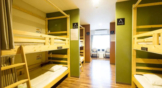 Кровать в общем номере BEPPU ROJIURA stay&sauna