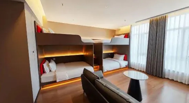 Кровать в общем номере Yue Ta H E-sports Hotel (Hami)