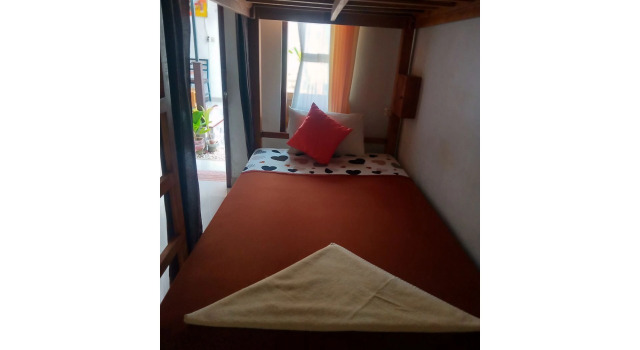 Postel ve společném pokoji Gedhong Hostel