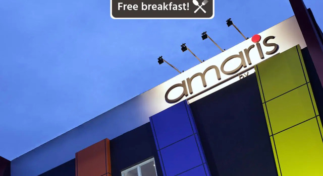 Кровать в общем номере Amaris Hotel Banjar