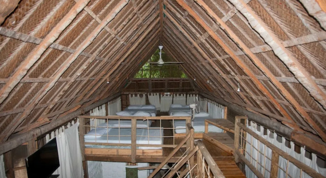 Кровать в общем номере EcoHostal Rio Piedra