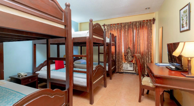 Кровать в общем номере OveMar Resort Hotel near Vigan