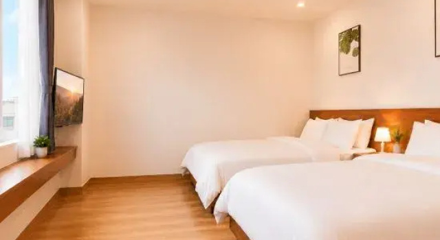 Кровать в общем номере Yuanju Homestay