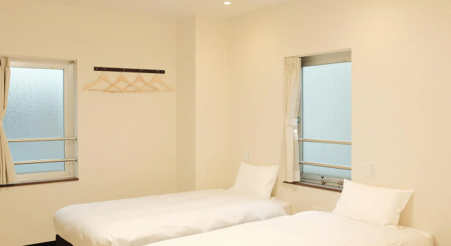 Кровать в общем номере KYU KYU HOTEL