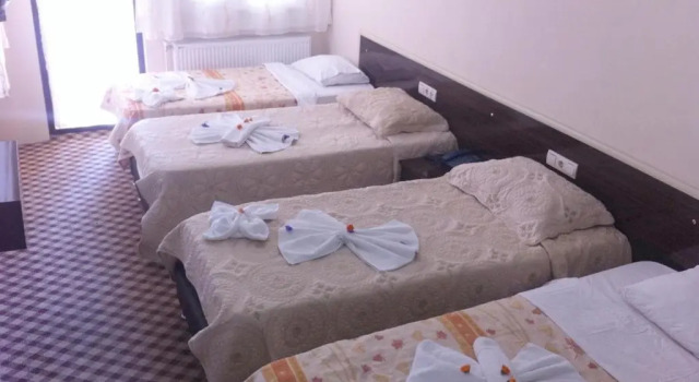 Кровать в общем номере Anatolia Hotel