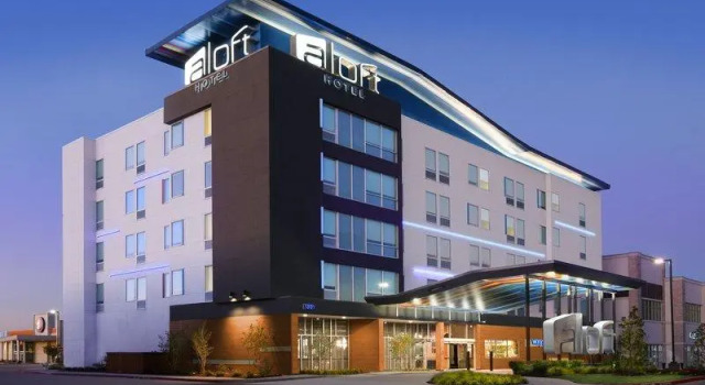 Кровать в общем номере Aloft by Marriott Dallas Euless