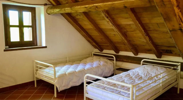 Кровать в общем номере Rifugio Casa Ressia