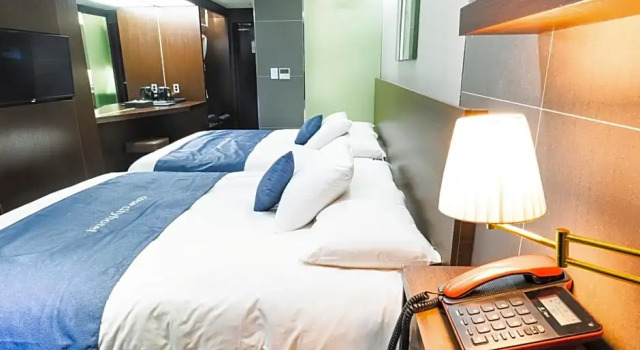 Четырёхместный семейный номер Deluxe CO-OP City Hotel Harborview