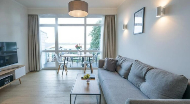 Apartment with a wonderful view of the Eider, Забронировать Апартаменты/квартира Апартаменты Тённинг, рядом с Гавань Тённинг, Апартаменты/квартира