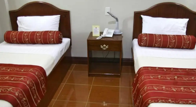 Кровать в общем номере Villa Maria Luisa Hotel