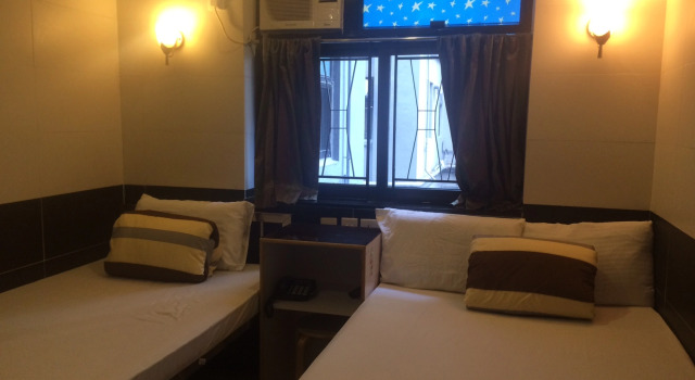 Кровать в общем номере Apple Hostel 蘋果賓館