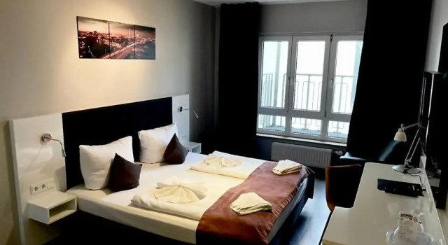 Superior Tweepersoonskamer uitgang op de binnenplaats ALFA Hotel