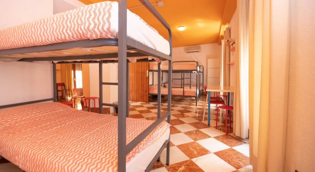 Кровать в общем номере Arce apartamentos
