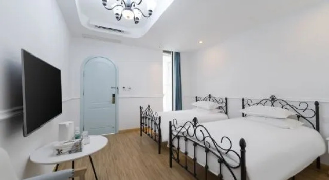 Кровать в общем номере с 6 комнатами Suzhou Xunmi Banshan Homestay