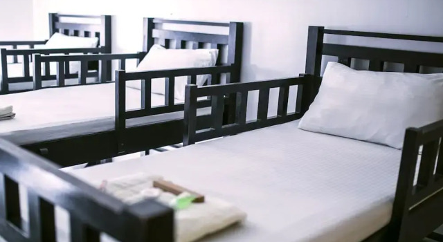 Кровать в общем номере Puerto Del Sol Beach Resort