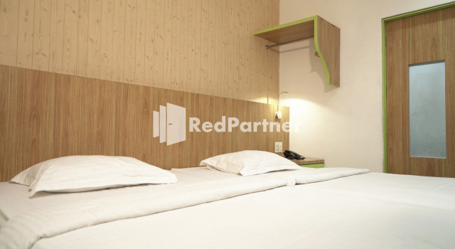 Номер Deluxe Wisma Sederhana Medan Mitra RedDoorz