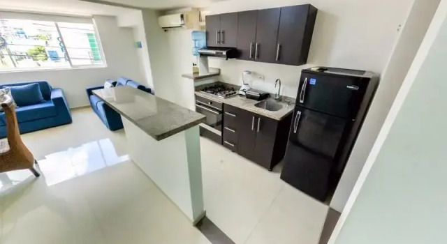 Кровать в общем номере с 6 комнатами White Coral ApartaSuites