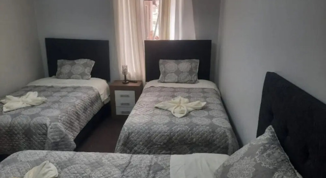 Cama en dormitorio compartido Valícha B&B breakfast