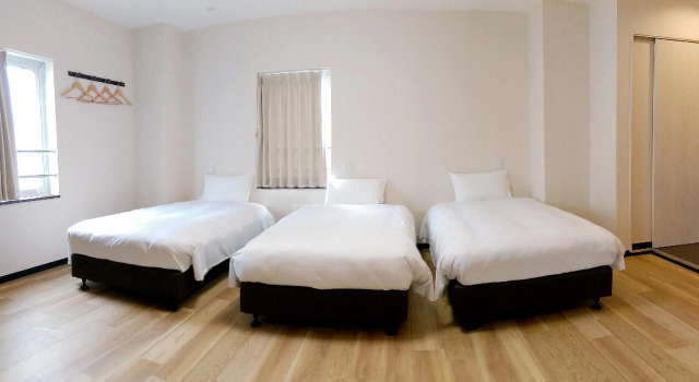 Кровать в общем номере KYU KYU HOTEL