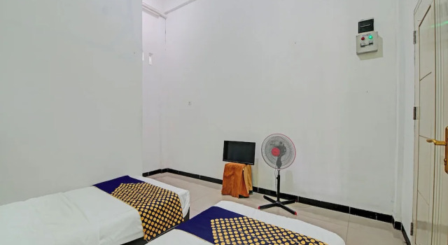 Номер Economy Hotel O Penginapan Puti SyariahNearBandara Sultan Syarif Kasim II