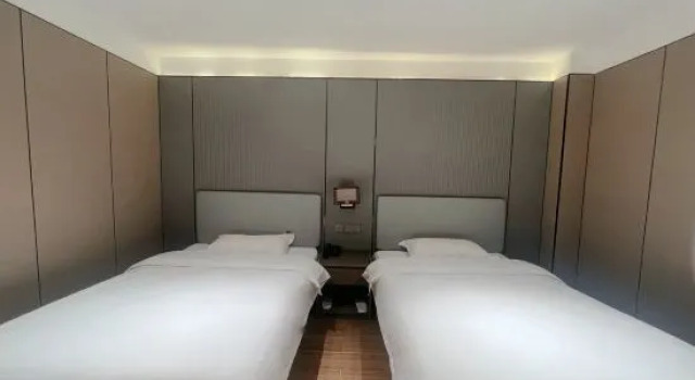 Кровать в общем номере Dehui Qiantang Elegant Restaurant Business Hotel