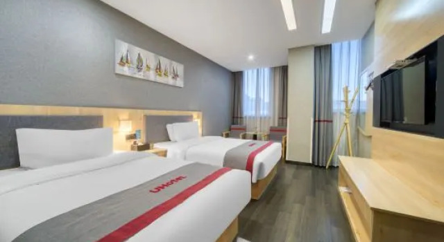 Трёхместный люкс Deluxe Shankee Hotel (Huzhou Zhili Children's Clothing City)