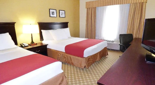 Шестиместный номер Standard Country Inn & Suites by Radisson, Port Orange-Daytona, FL