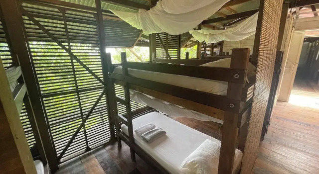 Кровать в общем номере с балконом Paganakan Dii Tropical Retreat