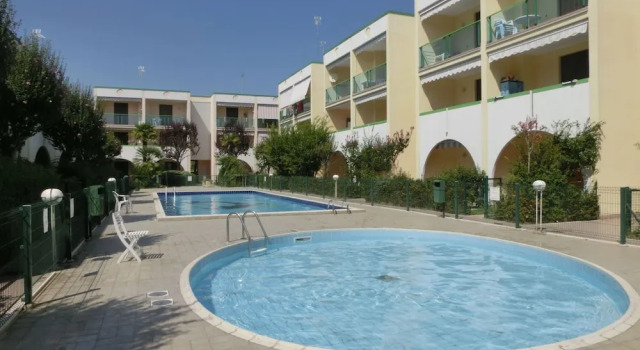 Feel at Home in This Apartment With Fenced Garden, Забронировать Апартаменты/квартира Отели Бибионе-Пинеда с парковкой, рядом с Долина Вальгранде, Парковка