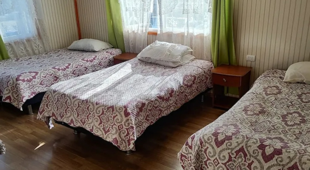 Кровать в общем номере Alma Patagona Coyhaique
