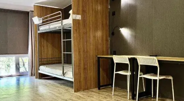 Кровать в общем номере Liangzhu Homestay (Urumqi Zhongyinggong Subway Station)