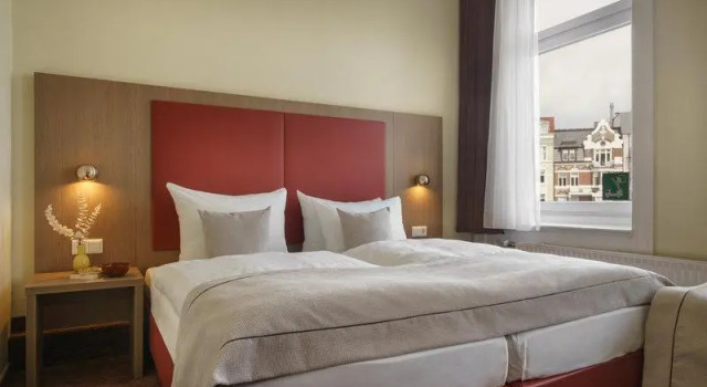 Кровать в общем номере Hotel Norddeutscher Hof