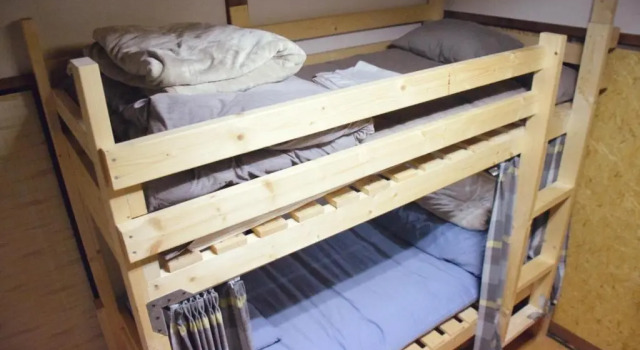 Кровать в общем номере Kakurega Guest House