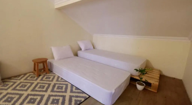 Bett im Wohnheim Oke Baik Hostel