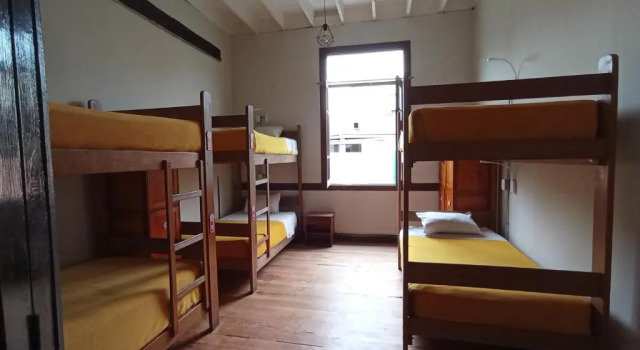 Кровать в общем номере Flying Dog Lima B&B
