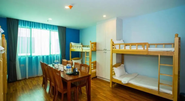 Кровать в общем номере Austin Park Hotel