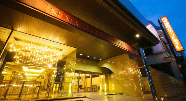 Кровать в общем номере Numazu Grand Hotel