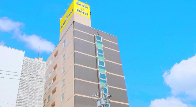 Кровать в общем номере Smile Hotel Asahikawa