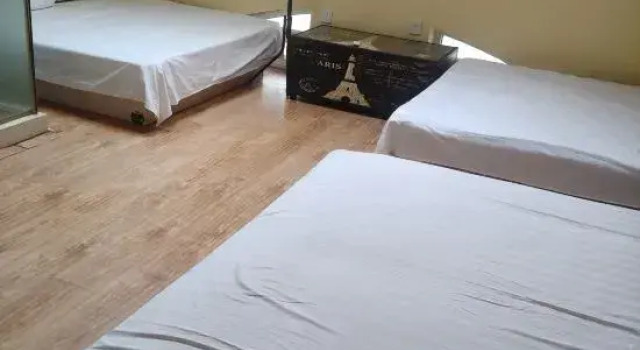 Кровать в общем номере Wafangdian Guanxinchao Hotel