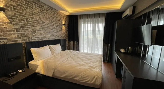 Номер Deluxe Sheltons Hotel
